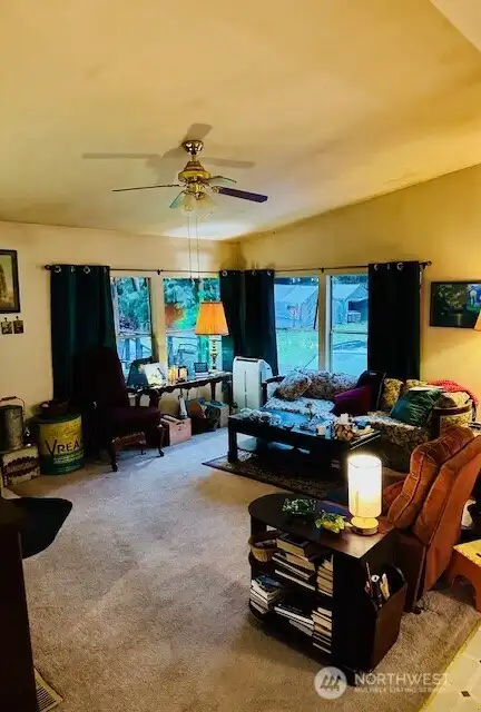 Living room from kitchen w/ fireplace