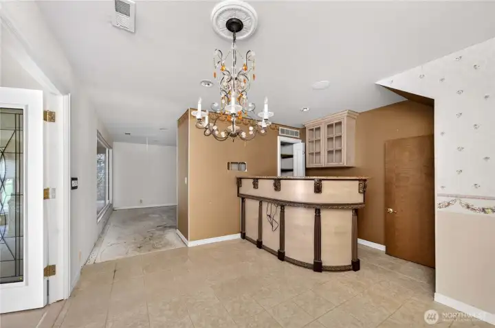 Downstairs entertaining space leading to family room and hot tub area.