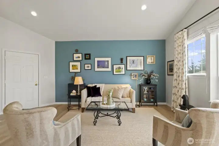 Accent walls with designer paint colors and custom curtains throughout give every space a comfortable yet stylish vibe.