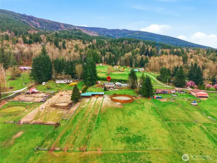 Looking east from above the upper pasture to see the long paddocks that flow up to the barn.