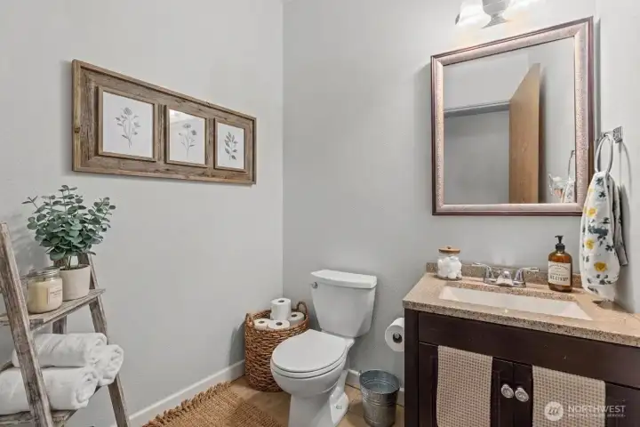 Half bath on main level. (some decor digitally staged)