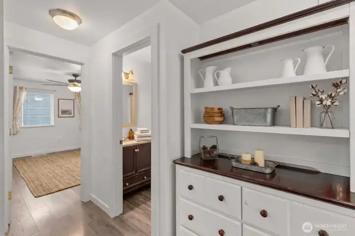 Upstairs hallway: decor on shelves is virtual.