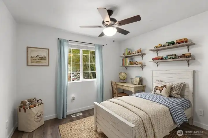 Bedroom 1 of 3 upstairs, ceiling fan, closet. (some decor digitally staged)