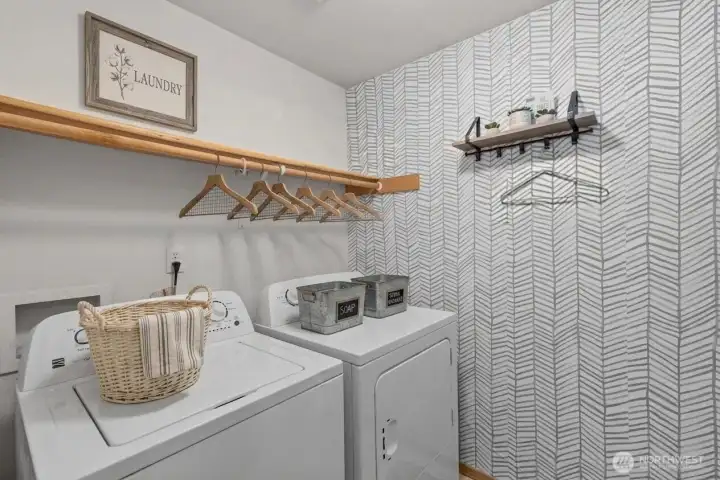 Laundry room, washer and dryer stay! Decor digitally staged.