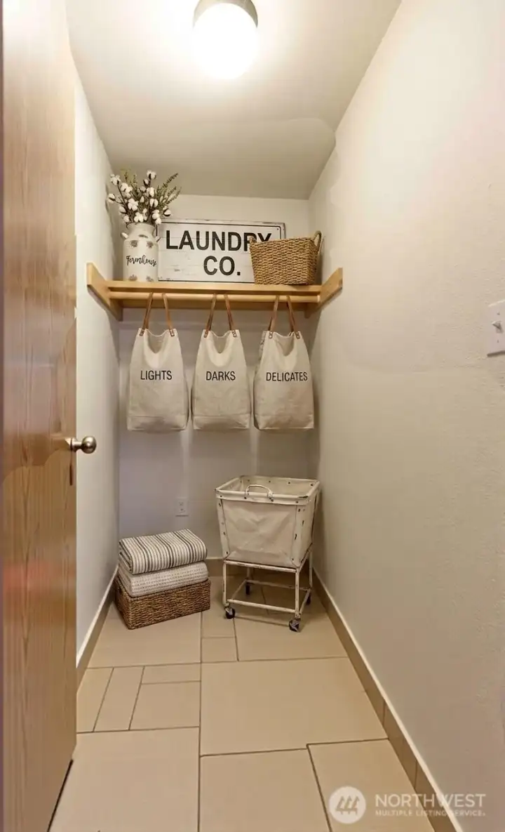 Bonus storage room off laundry, nice! (some decor digitally staged)