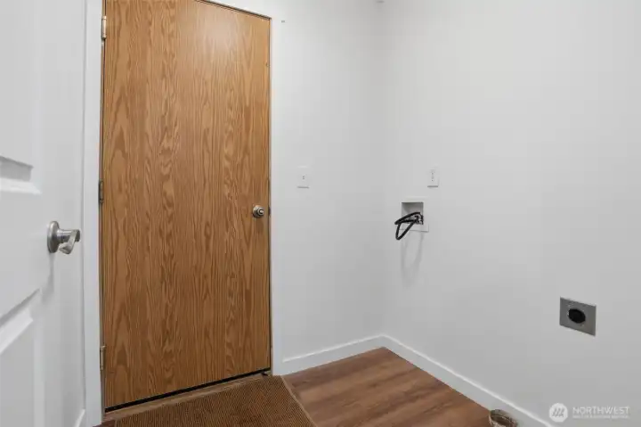 Laundry room leading to the garage