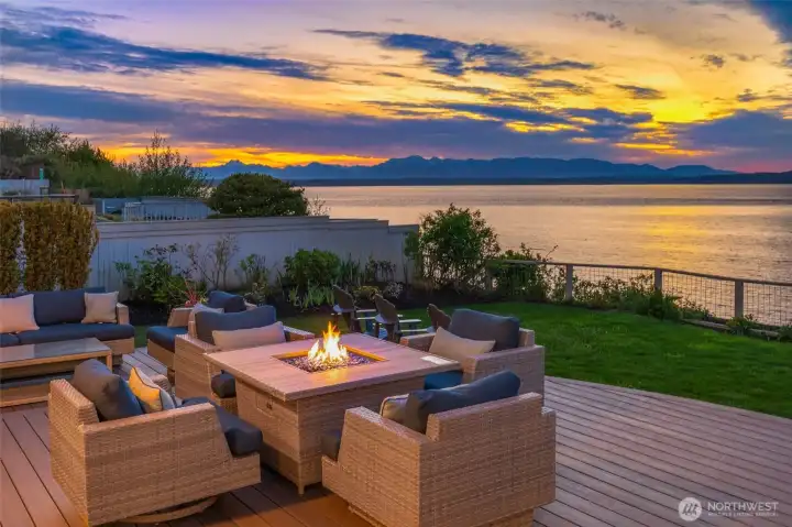 Expansive deck with an outdoor kitchen and a front-row seat to peaceful, mesmerizing views & stunning sunsets.
