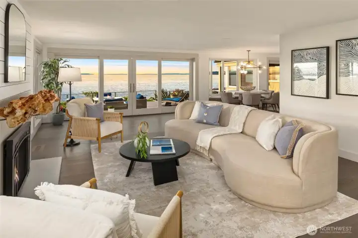 Living area surrounded by windows and breathtaking views! Gas fireplace with custom driftwood mantel.