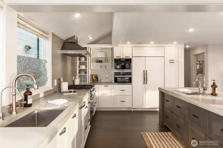 Beautiful custom kitchen with concrete counters, built-in coffee machine and more views!