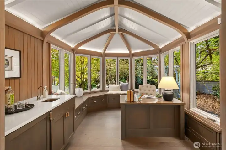 Main floor office area with wet bar and charming built-in seating and views of the Sound.
