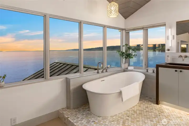 Primary suite luxurious soaking tub perfectly positioned to take in the scenery.