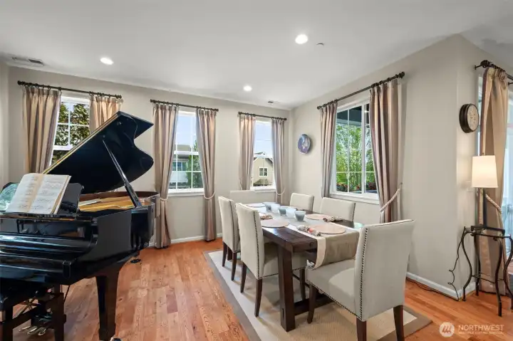 Dining room with gracious windows and window treatments.