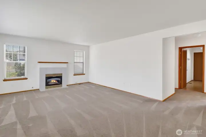 Living room is anchored by the gas fireplace providing warmth and relaxation.