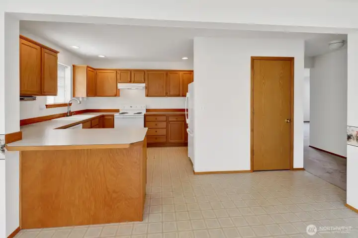 The home features a full-size kitchen with plenty of space to cook and gather. A convenient pantry adds extra storage, and all appliances are included—making this a truly move-in ready setup.