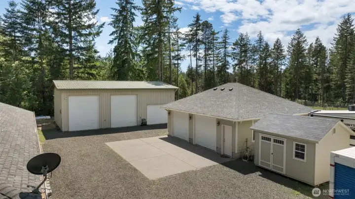 Here is where the property really separates itself, with a large shop, smaller shop, additional outbuilding, concrete parking pad, fresh gravel, and the kind of usable space that opens the door to hobbies, storage, equipment, projects, and serious flexibility.