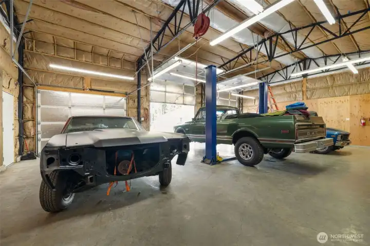 The large shop delivers serious capability, with three bays, high ceilings, full insulation, heat from its own furnace, and room for multiple vehicles, equipment, storage, or major projects.