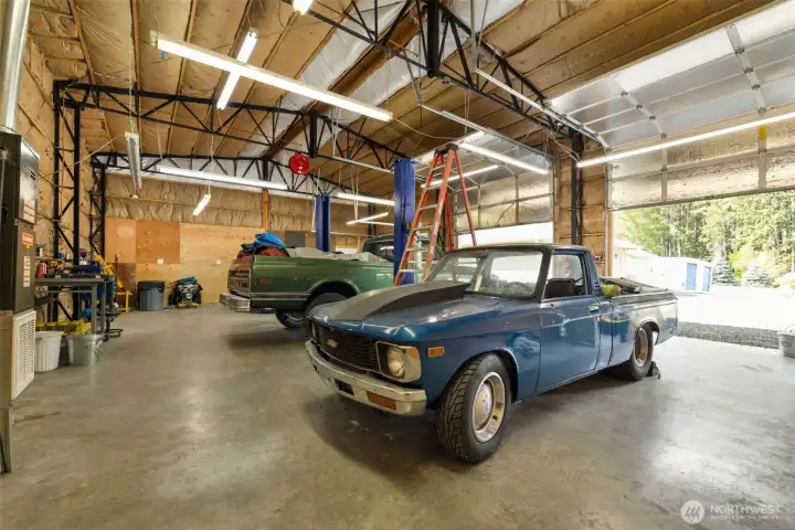 With the doors open, the scale of the large shop really comes through, offering the kind of open, heated, high ceiling workspace that can handle big ideas, big equipment, and plenty of room to move.