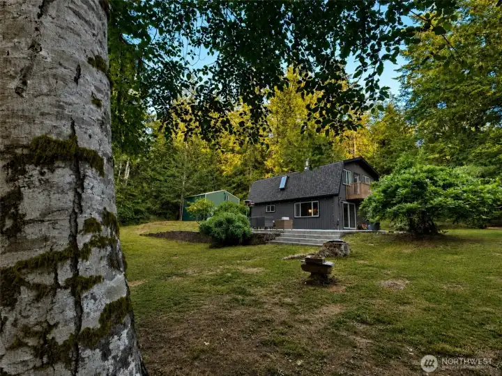 What a great yard for entertaining friends, enjoying quiet moments with nature and starting your garden. And that huge detached garage will house all the tools you'll need in order to keep your garden growing.