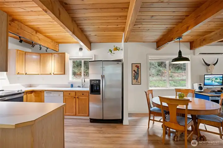 Now this is a kitchen you will truly enjoy. Bright and inviting with new stove/range, new track lighting and wood ceilings giving a cozy feel. Now this is a kitchen you will truly enjoy. Bright and inviting with new stove/range, new track lighting and wood ceilings giving a cozy feel.