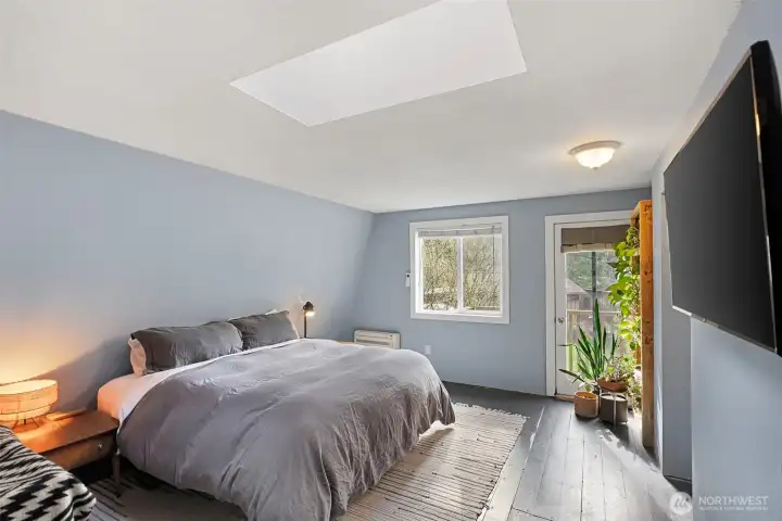 Imagine waking up here and stepping out to enjoy your morning beverage. The Primary Bedroom is graced with a skylight and your own private balcony. The hardwood floors are easy care making light of your housecleaning chores. Imagine waking up here and stepping out to enjoy your morning beverage. The Primary Bedroom is graced with a skylight and your own private balcony. The hardwood floors are easy care making light of your housecleaning chores.