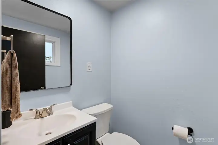 The 1/2 bath is located on the main floor near the front door. So convenient for guests or for washing up after being outside doing yard work. The 1/2 bath is located on the main floor near the front door. So convenient for guests or for washing up after being outside doing yard work.