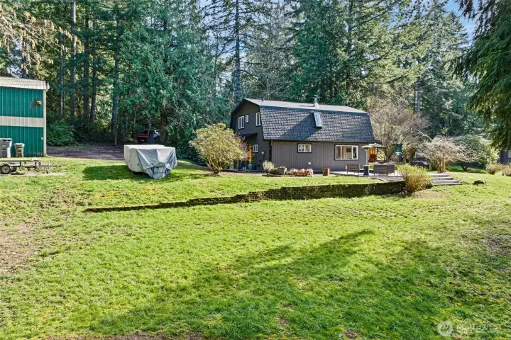 This picture shows the home and yard from lower on the property. There is plenty of space for your RVs, boats, and other toys. Want a garden? There is so much space to grow just about anything. Or maybe some chickens are in your future. Lots of places to build a chicken coop and have fresh eggs daily. This picture shows the home and yard from lower on the property. There is plenty of space for your RVs, boats, and other toys. Want a garden? There is so much space to grow just about anything. Or maybe some chickens are in your future. Lots of places to build a chicken coop and have fresh eggs daily.