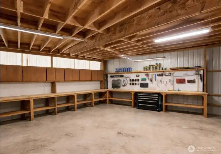 So much storage & room for all your toys. This is the lower level of the garage. Currently housing items for moving but this picture shows what it will looks like at closing. So much storage & room for all your toys. This is the lower level of the garage. Currently housing items for moving but this picture shows what it will looks like at closing.