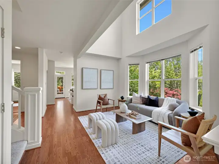 The airy living room has vaulted ceilings and looks out to the landscaped yard. The airy living room has vaulted ceilings and looks out to the landscaped yard.