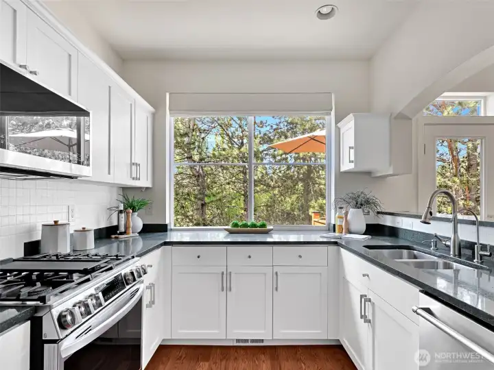 The updated kitchen is bathed in afternoon light The updated kitchen is bathed in afternoon light