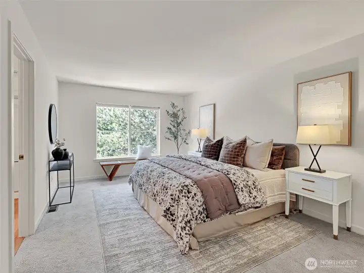 The primary bedroom is spacious, with room for a king bed and generous furniture The primary bedroom is spacious, with room for a king bed and generous furniture