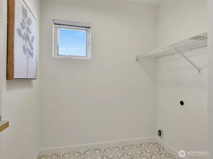 The oversized laundry room is conveniently located by the bedrooms upstairs. W/D to be installed prior to closing The oversized laundry room is conveniently located by the bedrooms upstairs. W/D to be installed prior to closing