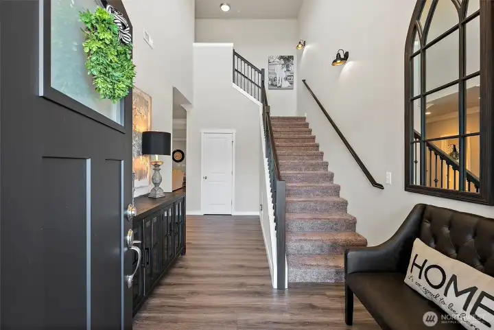 Soaring ceilings, wrought iron stair railings and expansive engineered hardwood flooring set your first impression as you enter this comfortable space with an elevated design Soaring ceilings, wrought iron stair railings and expansive engineered hardwood flooring set your first impression as you enter this comfortable space with an elevated design