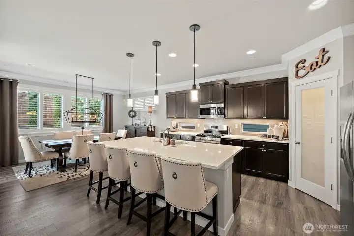 The oversized breakfast bar and dining space offer so much room for entertaining or casual dining. The walk-in pantry provides great storage for your Costco runs The oversized breakfast bar and dining space offer so much room for entertaining or casual dining. The walk-in pantry provides great storage for your Costco runs