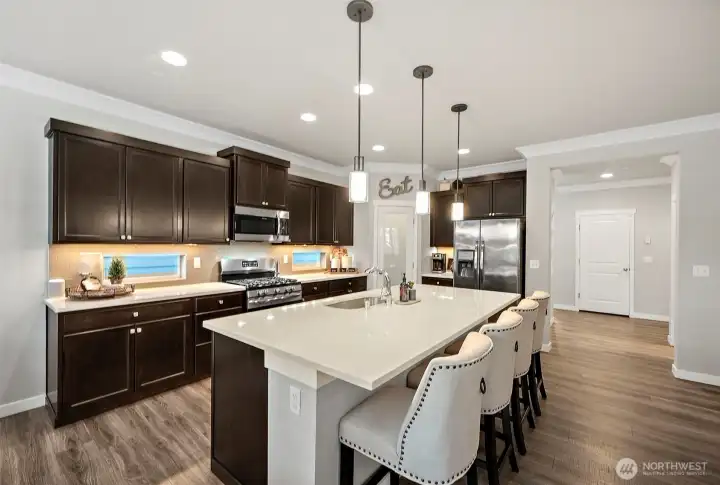 Another view of the kitchen and the stainless steel side by side fridge with ice & water is included Another view of the kitchen and the stainless steel side by side fridge with ice & water is included