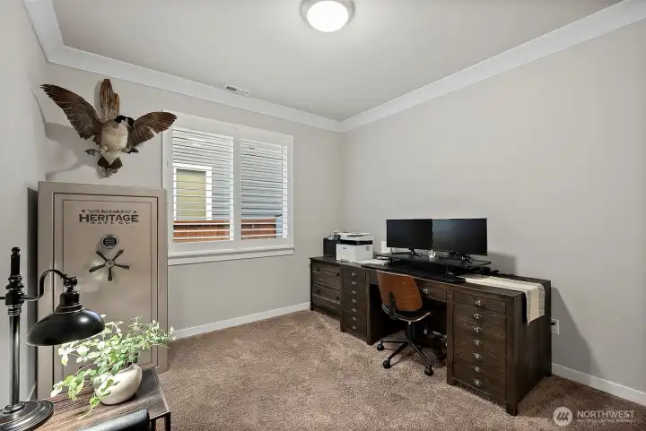 The main level den with double door entry and a closet creates a great office space or optional 5th bedroom The main level den with double door entry and a closet creates a great office space or optional 5th bedroom