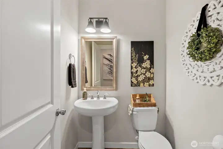The guest powder room is nicely tucked away and The guest powder room is nicely tucked away and