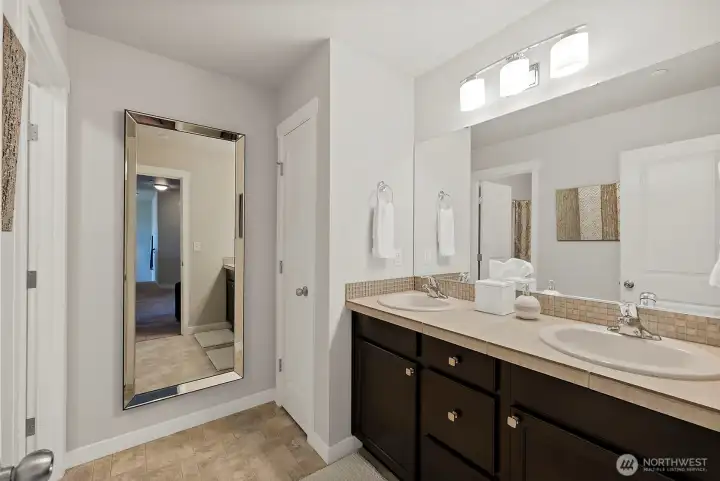 The large main bath offers a separate shower space and double sinks for prepping your crew. More linens/storage space is included here too The large main bath offers a separate shower space and double sinks for prepping your crew. More linens/storage space is included here too