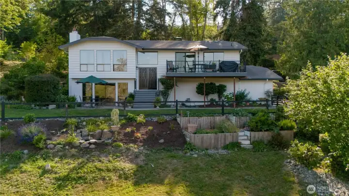Updated home sitting on a large lot surrounded by mature landscaping!