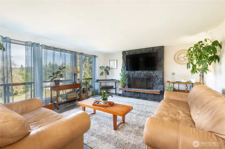 Custom wood and tile hearth. Wood-burning fireplaces on both levels