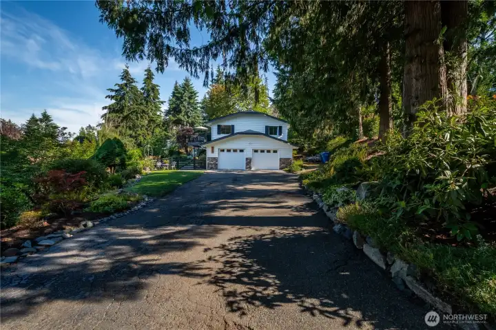 Oversized 2 Car Garage, and a long driveway with tons of parking.