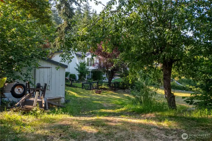 Garden shed for additional storage on property, and extra parking on other side of property