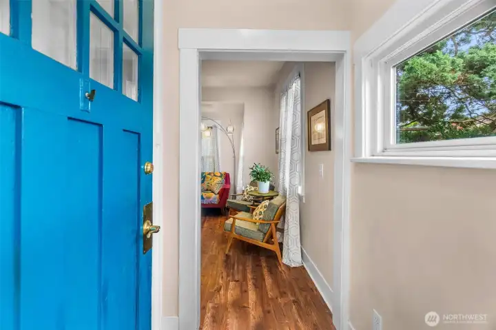 Potentially original door with glass inserts & a functioning twist doorbell that takes you back in time.