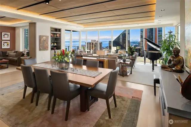 Dining Room with Living Room in background and idyllic views of the City in background.