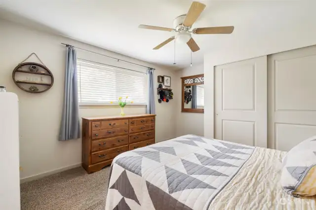 Primary bedroom on main level!  Window looks out over the large backyard and is very private.
