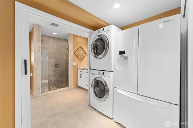 Large utility room with full sized stack w/d & extra fridge