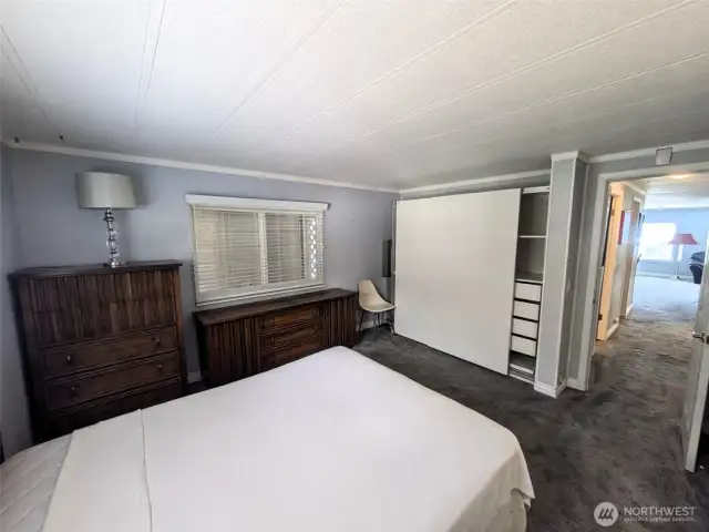 Primary bedroom with built-in closet system