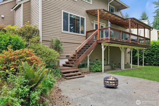 View of backyard with area for firepit and entertaining