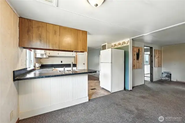 Dining area looking into kitchen