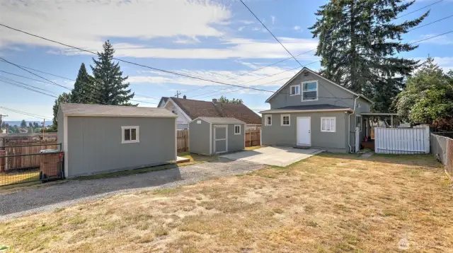 Good-sized, fully fenced and gated backyard with two sheds!