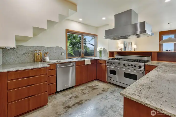Chef's kitchen with lots of storage and high end appliances.